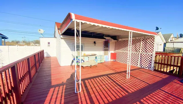 a balcony with wooden floor