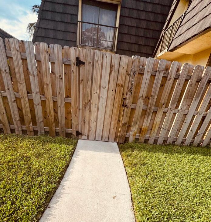 4626 Cherry Road West Palm Beach, FL 33417 - Photo 5 of 8 a view of a backyard with wooden fence