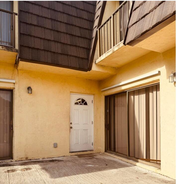 4626 Cherry Road West Palm Beach, FL 33417 - Photo 6 of 8 a view of a door