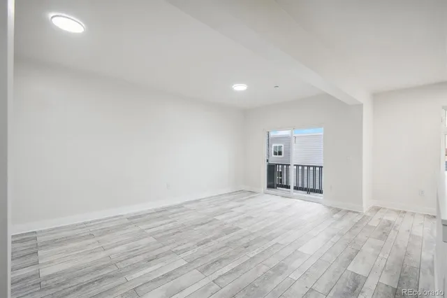 a view of a livingroom with wooden floor