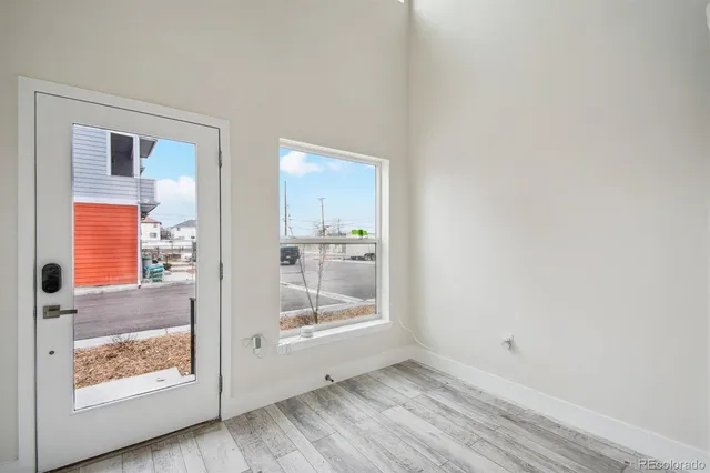 a view of an empty room and glass door