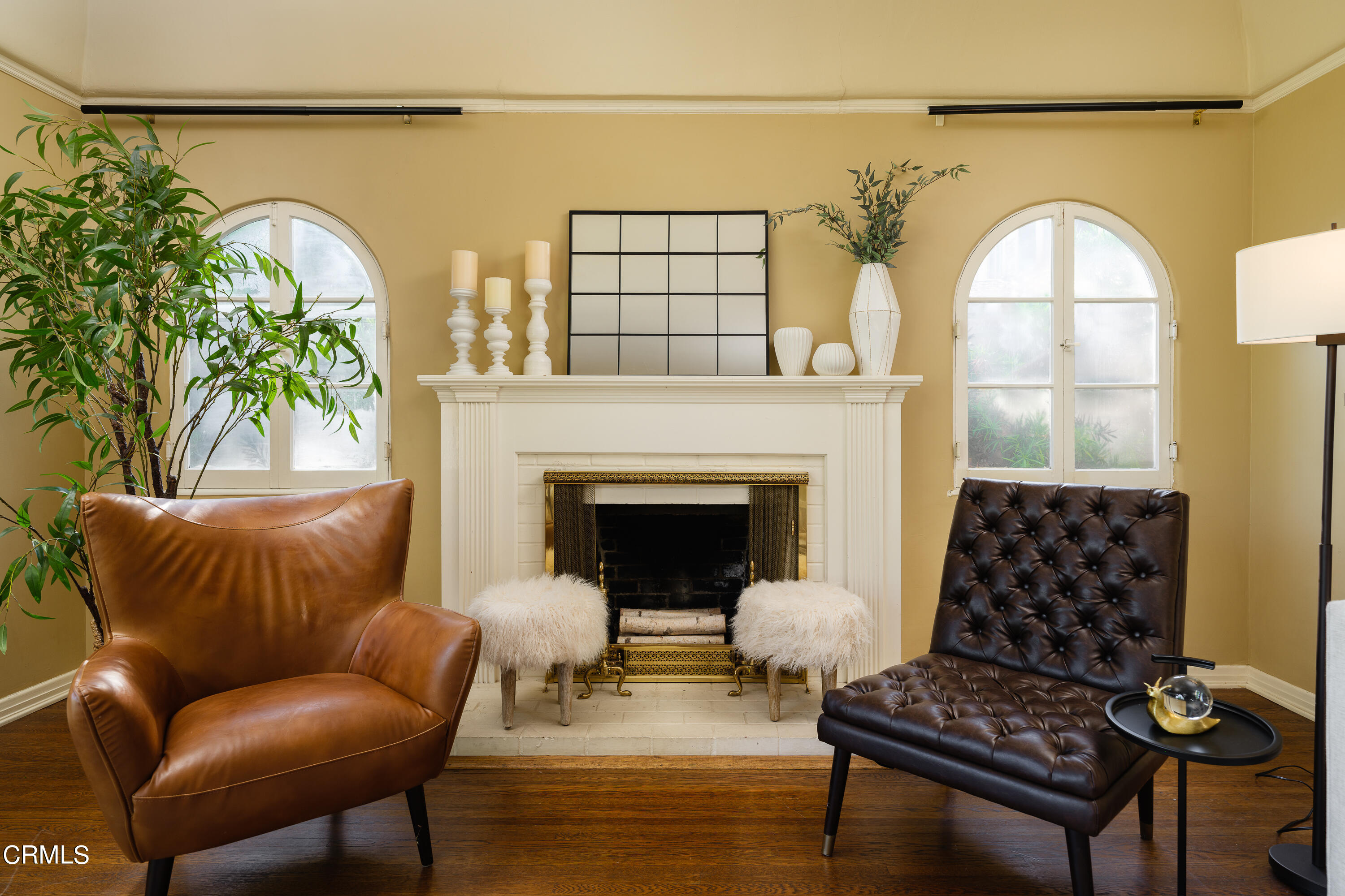 981 Parkman Street Altadena, CA 91001 - Photo 15 of 75 a living room with a couch a fireplace and a potted plant