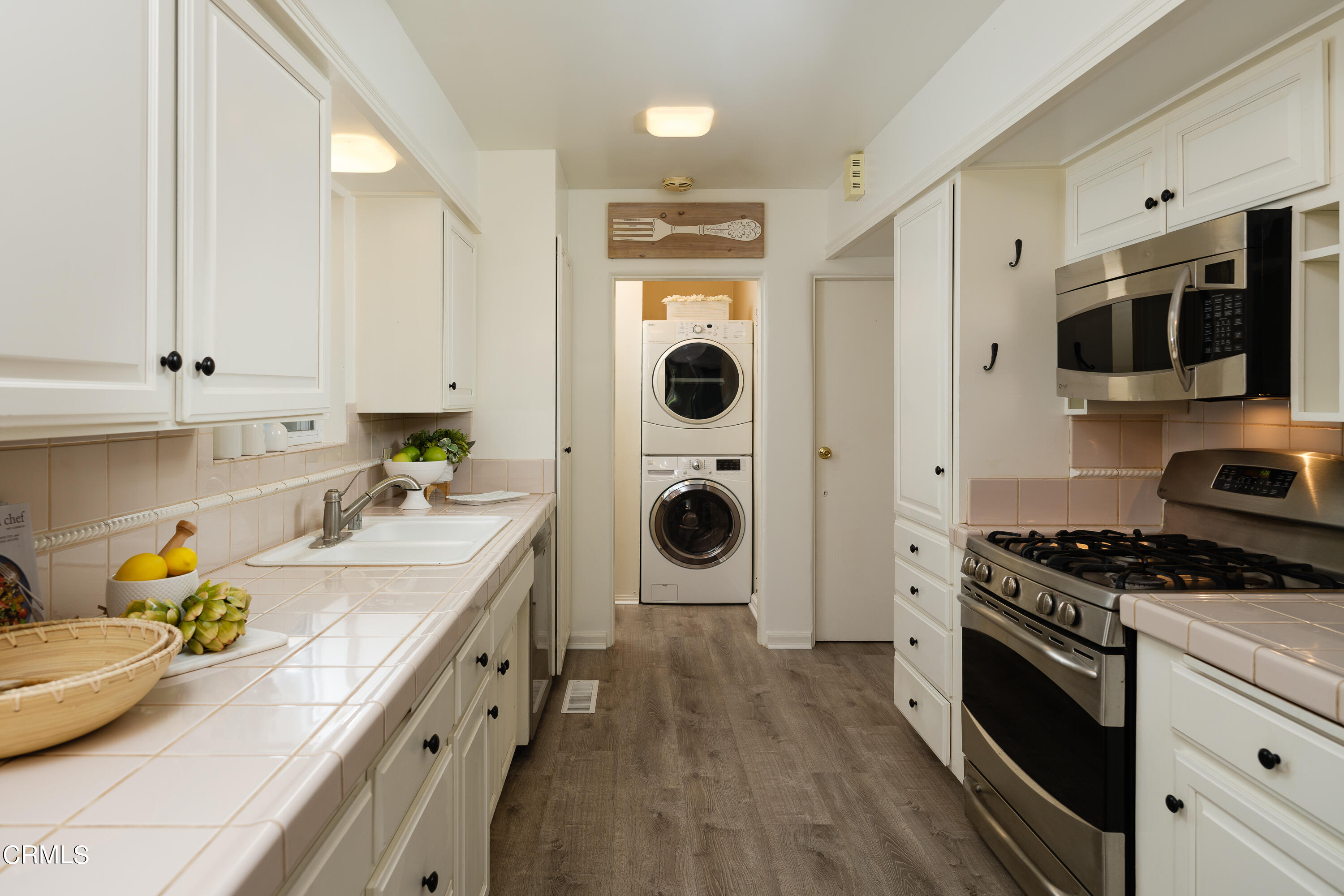 981 Parkman Street Altadena, CA 91001 - Photo 21 of 75 a kitchen with stainless steel appliances granite countertop a stove and a sink