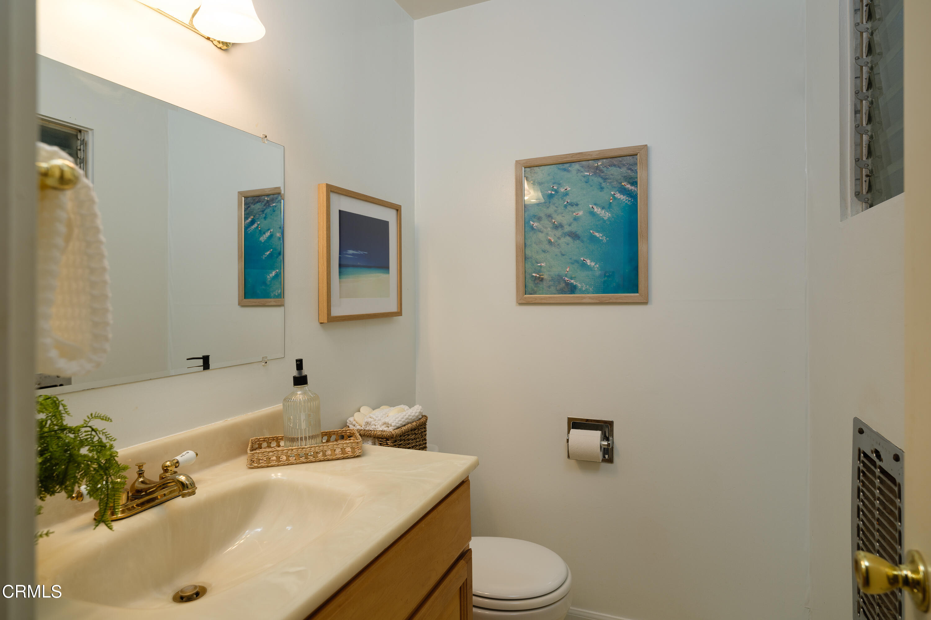 981 Parkman Street Altadena, CA 91001 - Photo 42 of 75 a bathroom with a sink and mirror with toilet