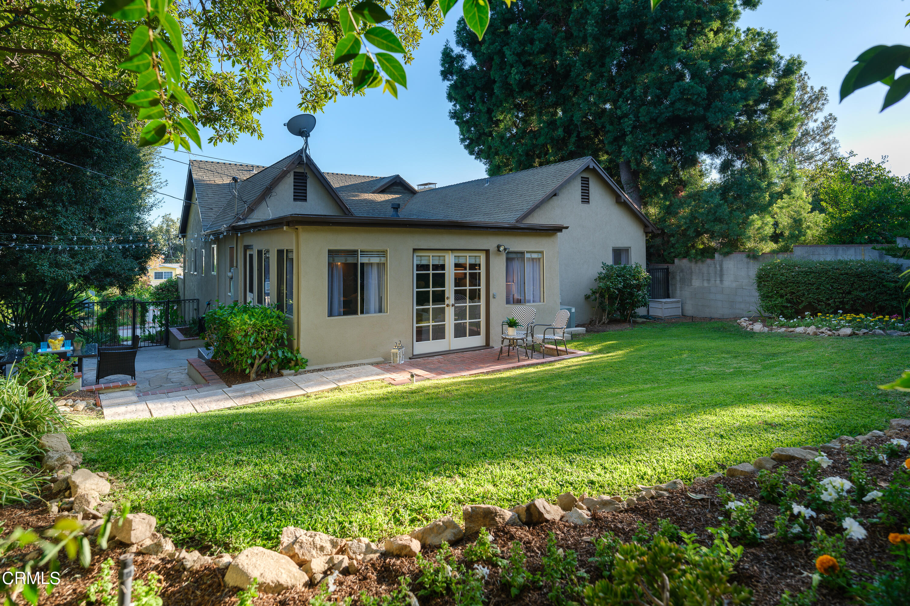 981 Parkman Street Altadena, CA 91001 - Photo 48 of 75 a front view of a house with a yard and garage