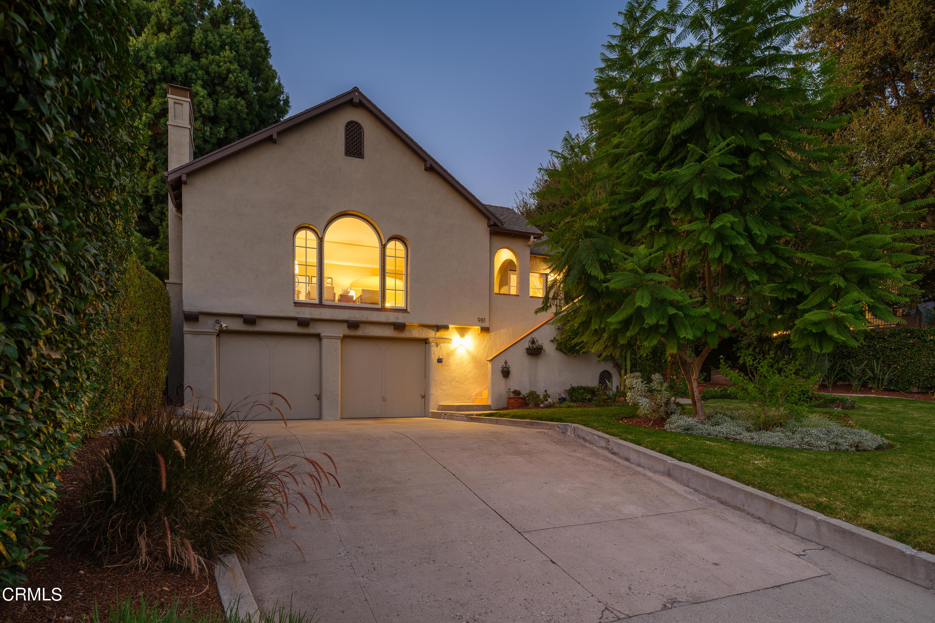 981 Parkman Street Altadena, CA 91001 - Photo 68 of 75 a front view of a house with a yard and garage