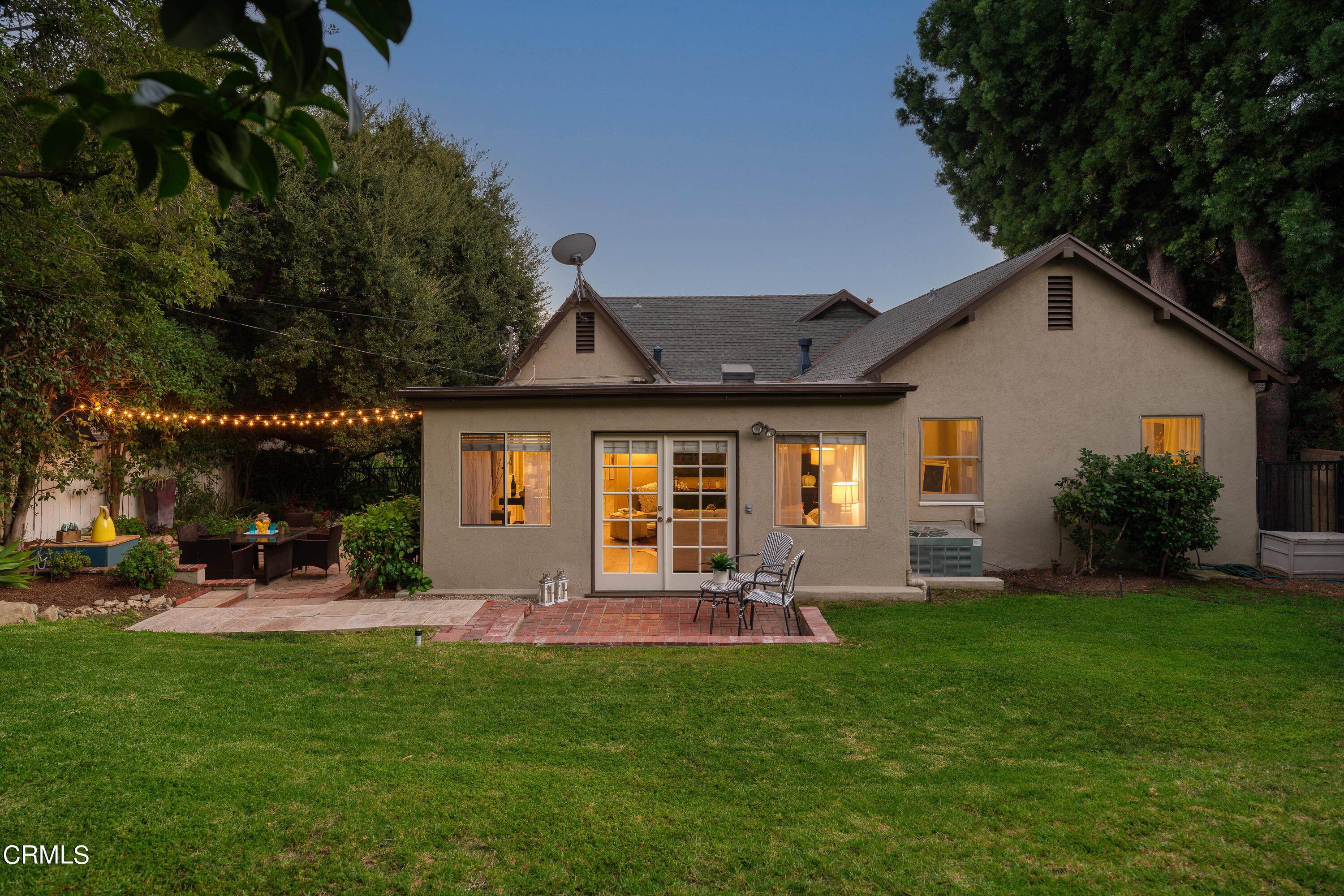 981 Parkman Street Altadena, CA 91001 - Photo 74 of 75 a front view of a house with a yard fire pit and outdoor seating