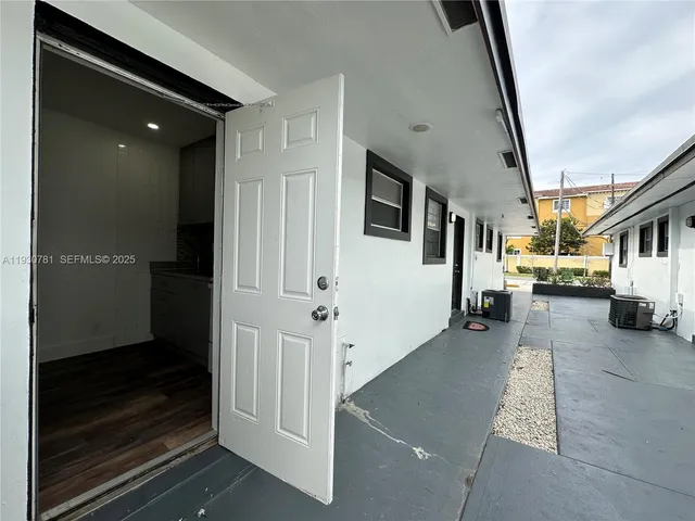 a view of a hallway with living room