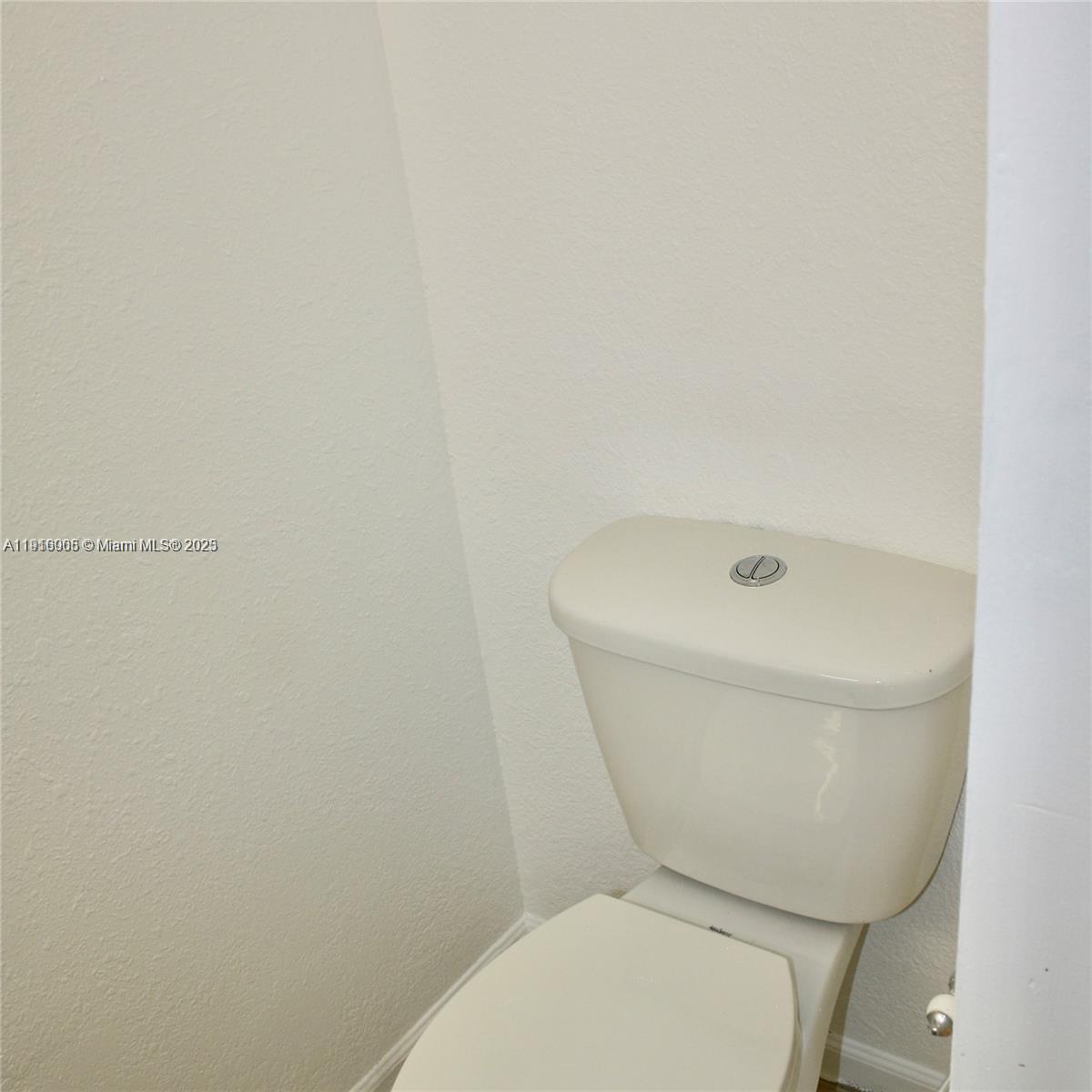 2079 West 54th Terrace, Unit 29 Hialeah, FL 33016 - Photo 12 of 43 a white toilet sitting next to a shower