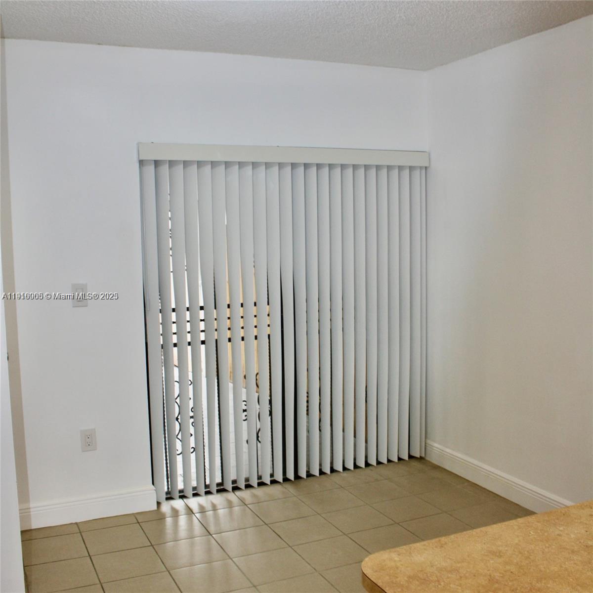 2079 West 54th Terrace, Unit 29 Hialeah, FL 33016 - Photo 13 of 43 an empty room with a window