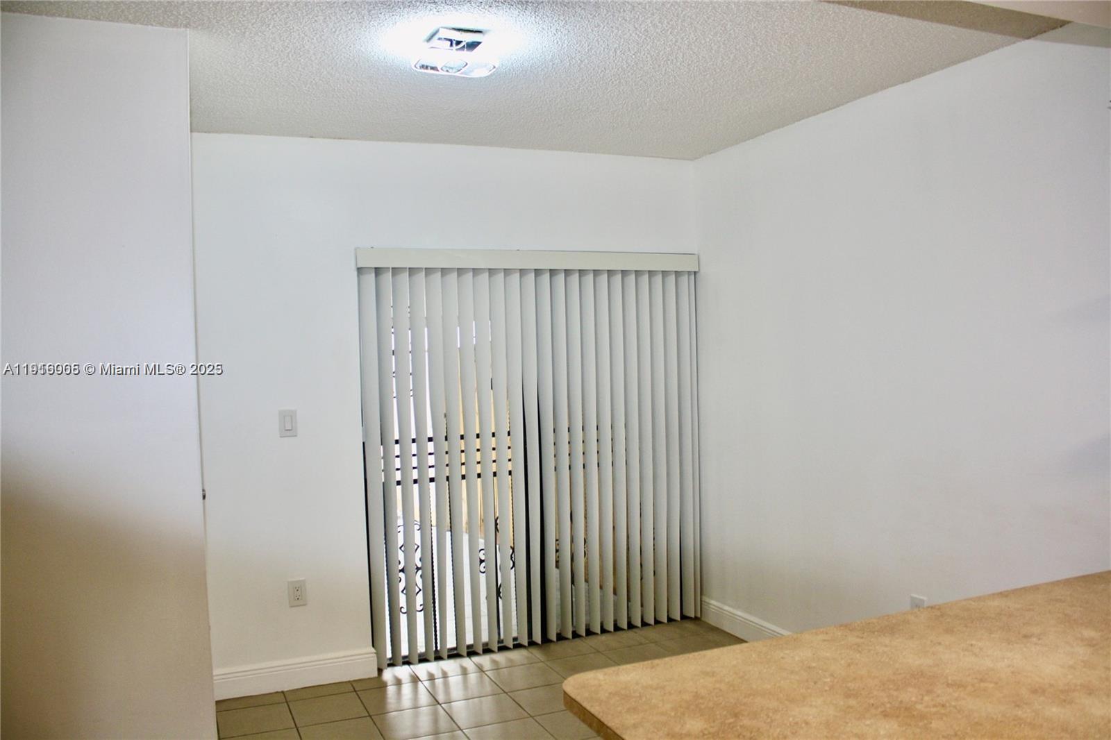 2079 West 54th Terrace, Unit 29 Hialeah, FL 33016 - Photo 14 of 43 a view of a room with wooden floor