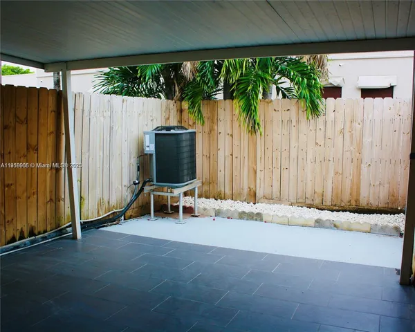 a view of backyard with a patio