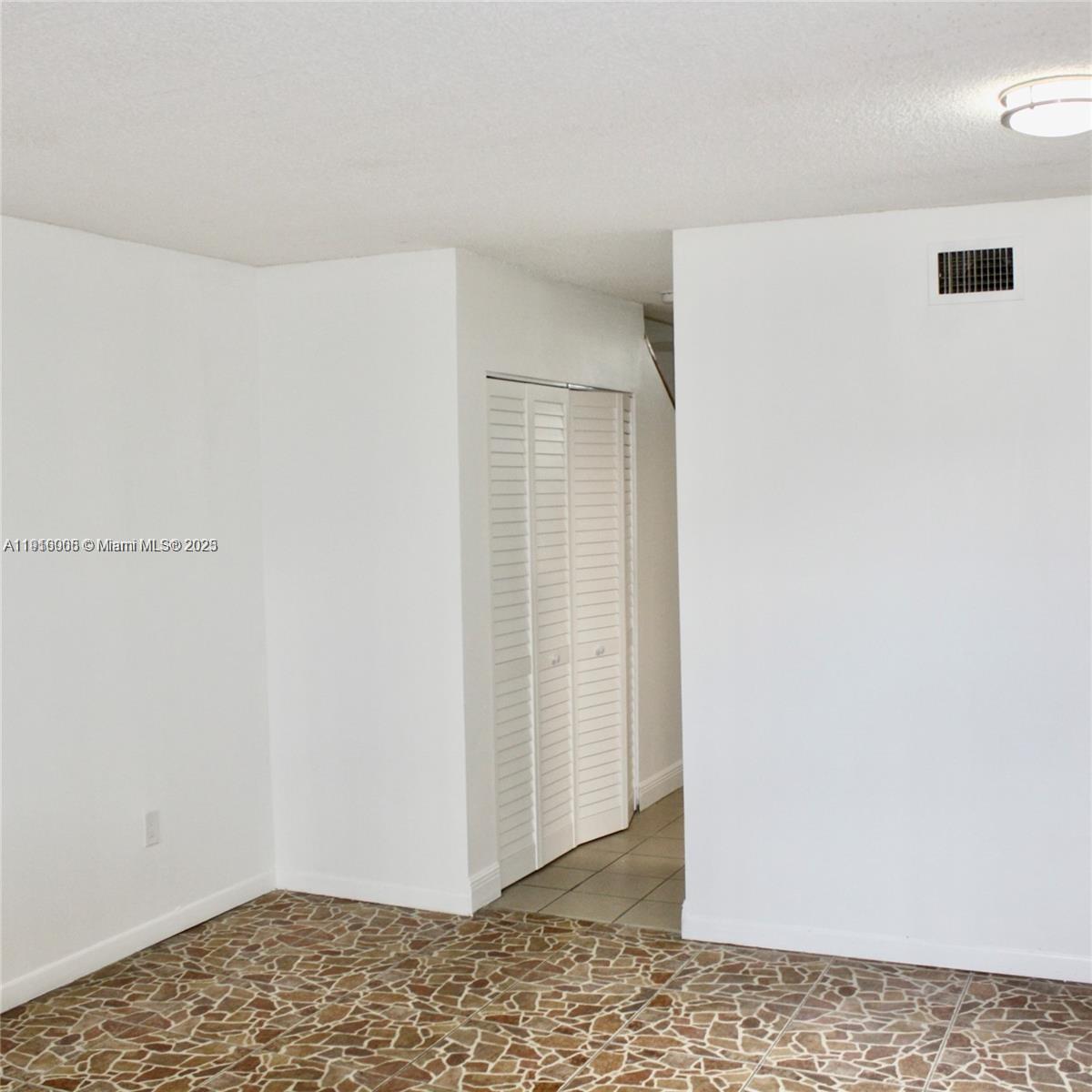 2079 West 54th Terrace, Unit 29 Hialeah, FL 33016 - Photo 22 of 43 a view of an empty room