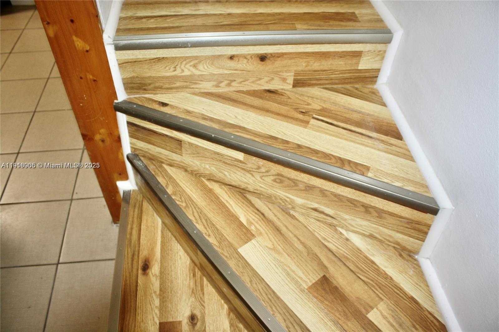 2079 West 54th Terrace, Unit 29 Hialeah, FL 33016 - Photo 25 of 43 a view of a staircase