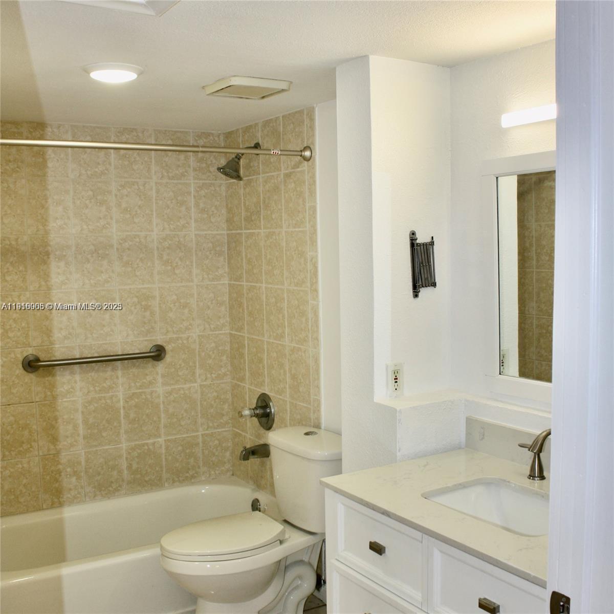2079 West 54th Terrace, Unit 29 Hialeah, FL 33016 - Photo 32 of 43 a bathroom with a sink a toilet and shower