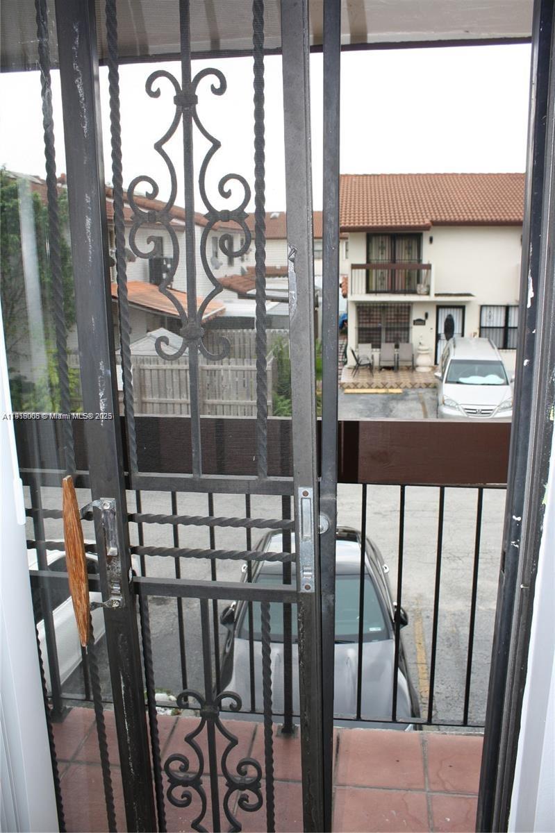 2079 West 54th Terrace, Unit 29 Hialeah, FL 33016 - Photo 35 of 43 a view of a chairs and table in the balcony