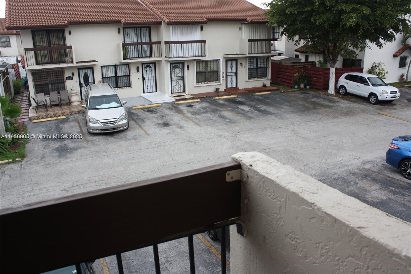 2079 West 54th Terrace, Unit 29 Hialeah, FL 33016 - Photo 36 of 43 a car parked in front of a building