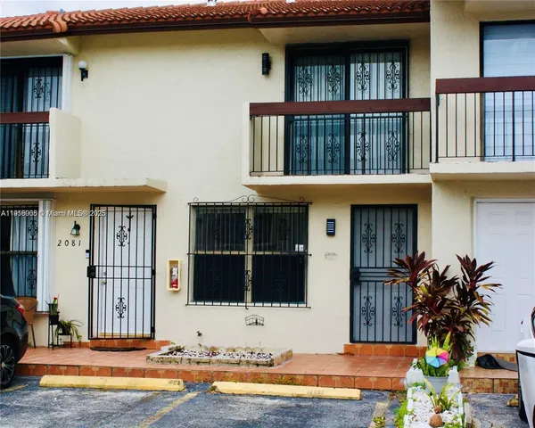 a view of house with outdoor space and swimming pool