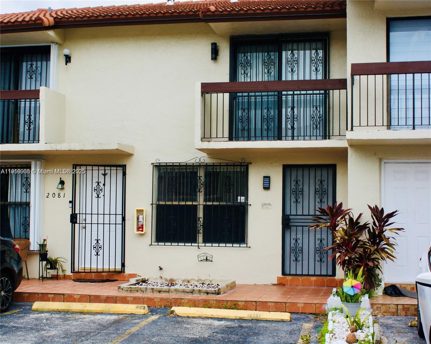 2079 West 54th Terrace, Unit 29 Hialeah, FL 33016 - Photo 43 of 43 a view of house with outdoor space and swimming pool