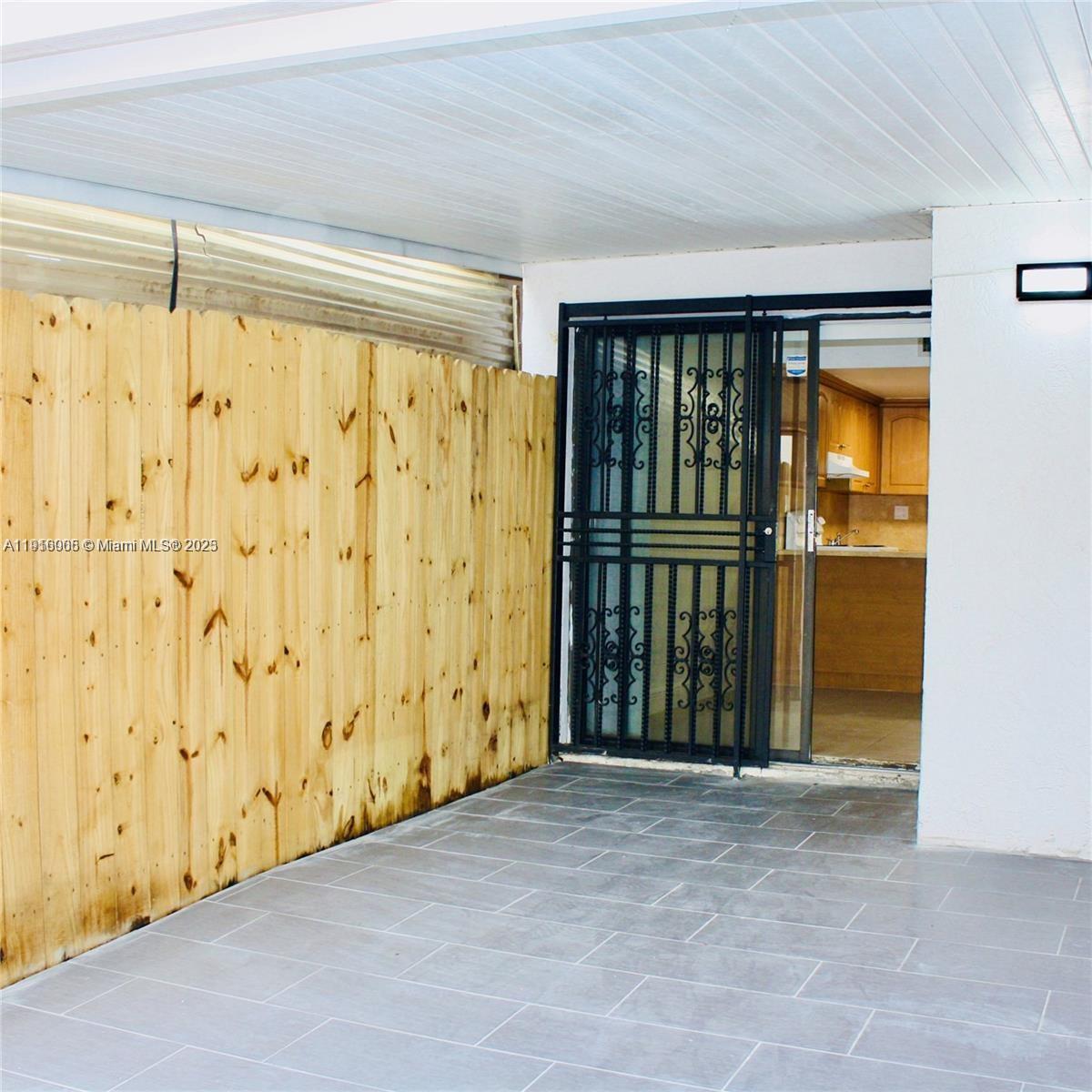 2079 West 54th Terrace, Unit 29 Hialeah, FL 33016 - Photo 6 of 43 a view of entryway with wooden floor