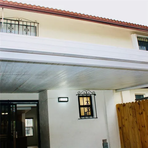 a view of a living room and entryway
