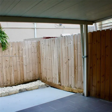 a view of a door with wooden floor