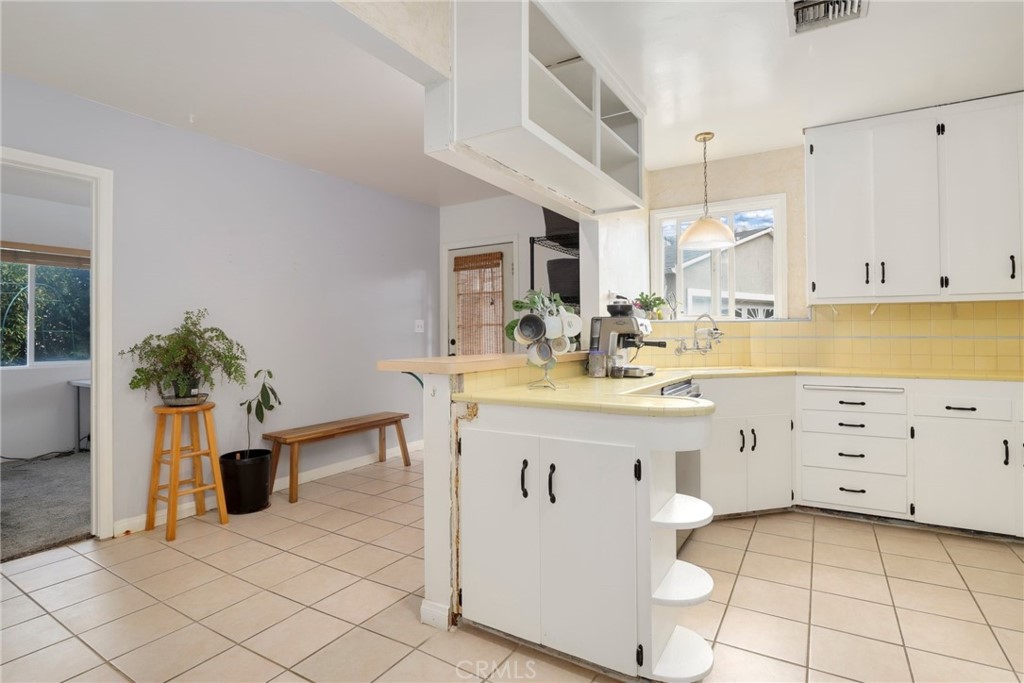 234 North Martha Place Fullerton, CA 92833 - Photo 11 of 46 a kitchen with cabinets and wooden floor