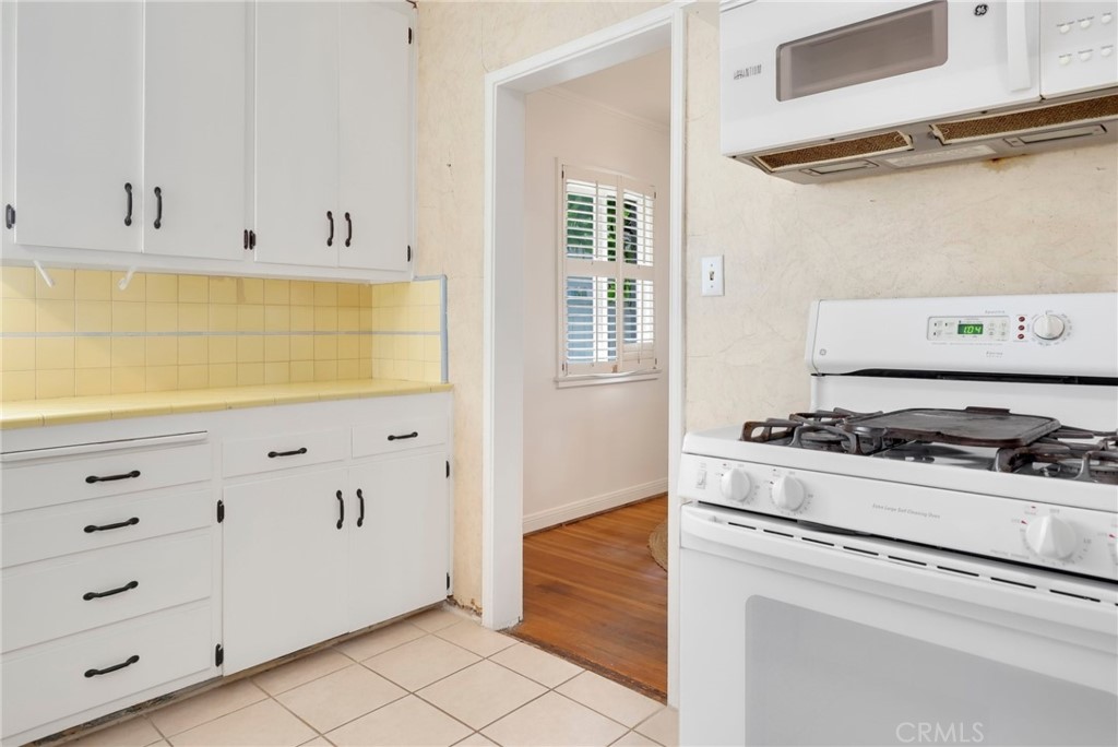 234 North Martha Place Fullerton, CA 92833 - Photo 14 of 46 a kitchen with cabinets and appliances