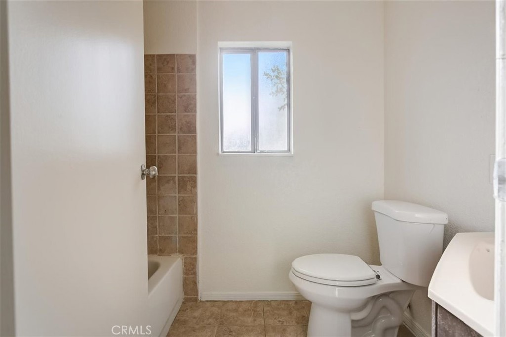 234 North Martha Place Fullerton, CA 92833 - Photo 41 of 46 a white toilet sitting next to a shower