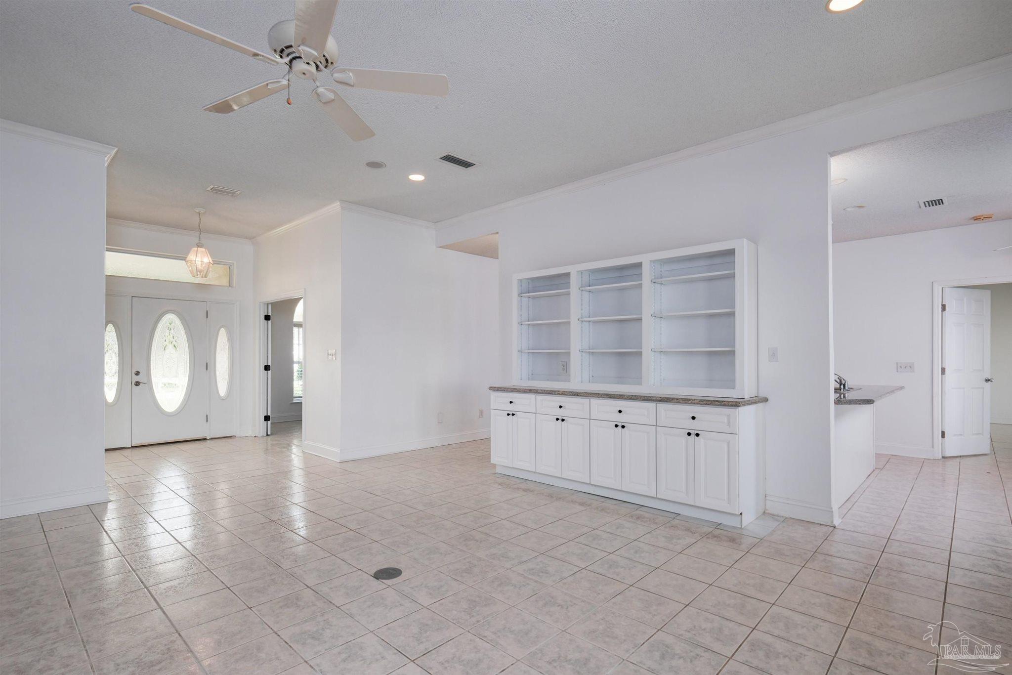 5450 North Shore Road Pensacola, FL 32507 - Photo 18 of 62 a view of an empty room with a cabinet and a window