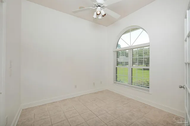 a large kitchen with a large counter top stainless steel appliances and cabinets