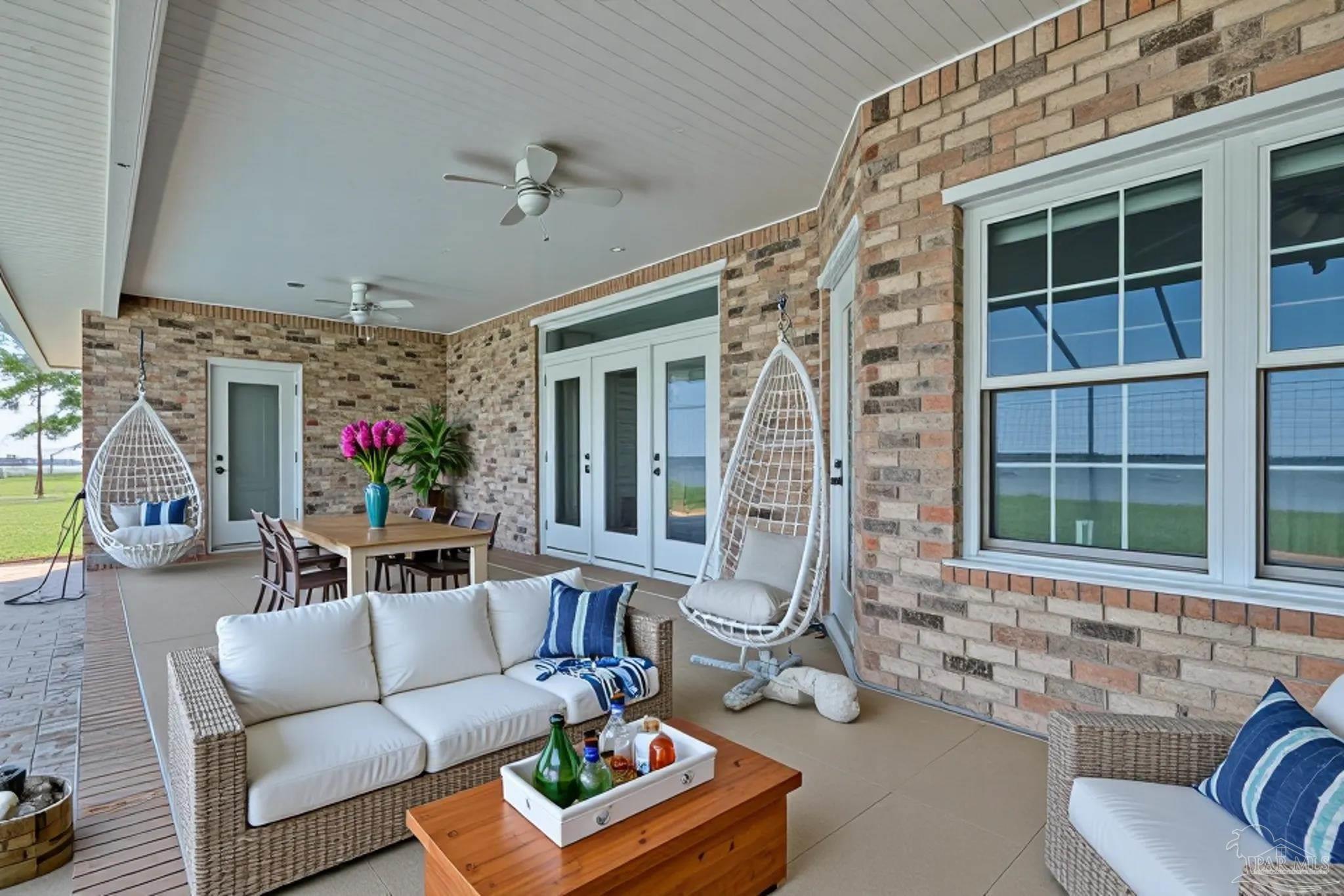 5450 North Shore Road Pensacola, FL 32507 - Photo 29 of 62 a building outdoor space with patio furniture