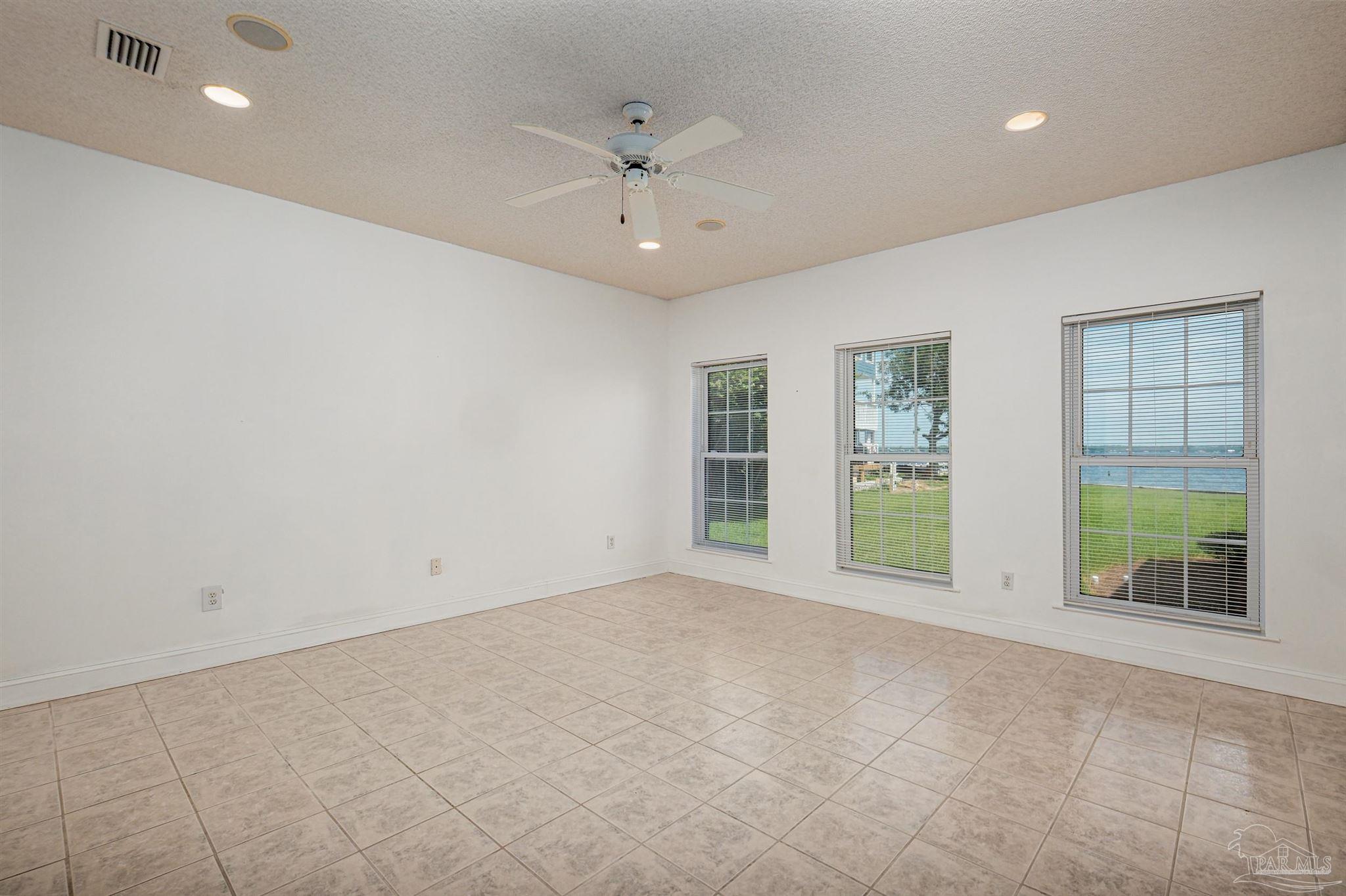 5450 North Shore Road Pensacola, FL 32507 - Photo 35 of 62 a view of an empty room with a window