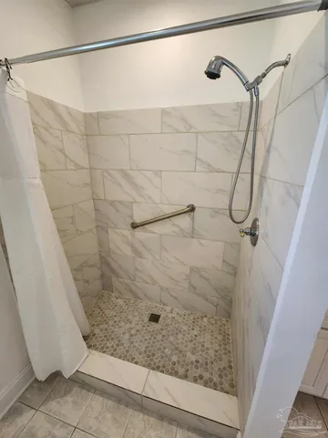 a view of an house with backyard space and balcony