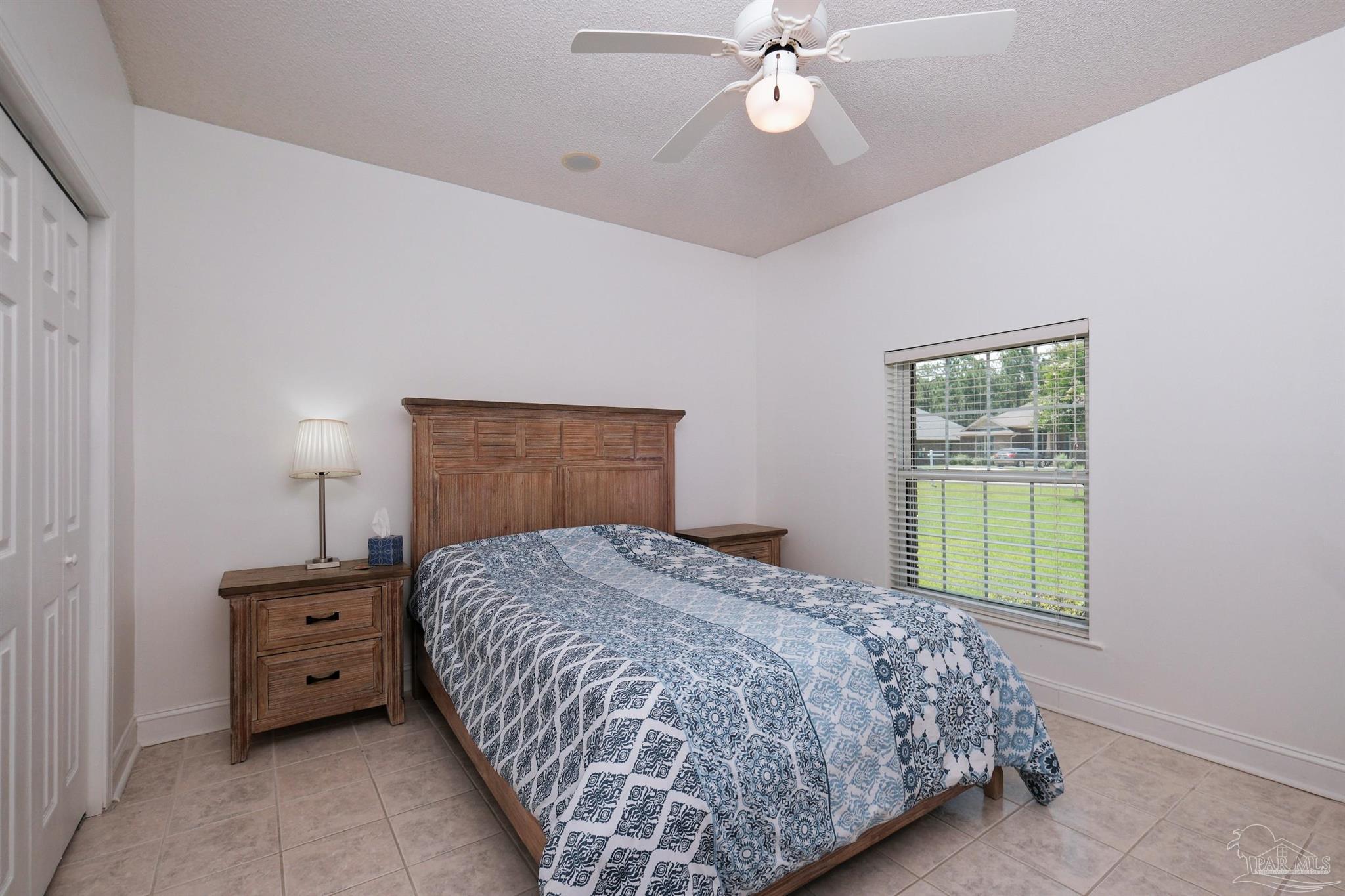5450 North Shore Road Pensacola, FL 32507 - Photo 40 of 62 a bedroom with a bed and a window