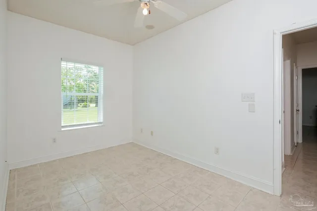a view of a swimming pool and lounge chairs