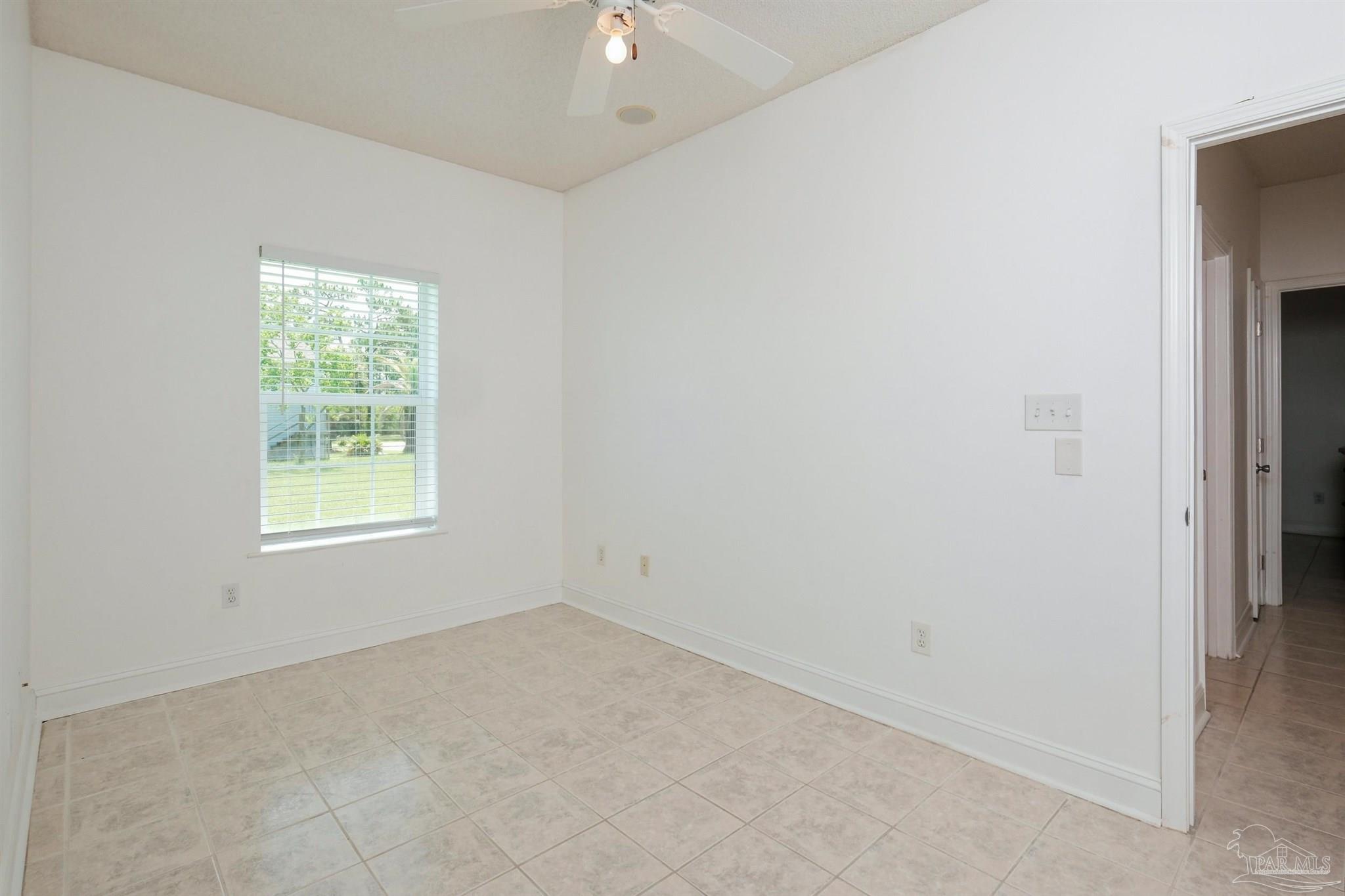 5450 North Shore Road Pensacola, FL 32507 - Photo 43 of 62 an empty room with a window