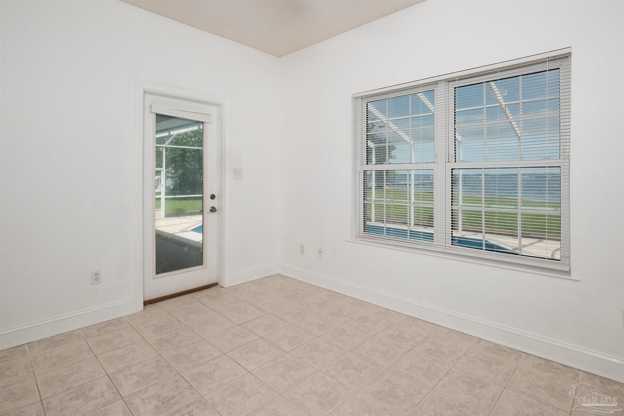 5450 North Shore Road Pensacola, FL 32507 - Photo 44 of 62 a view of an empty room with a window