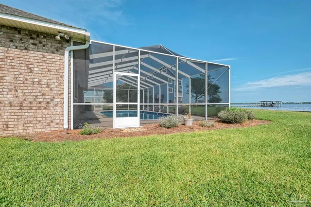 a view of balcony with a table and chairs