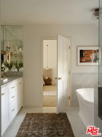 a bedroom with a bed and a table