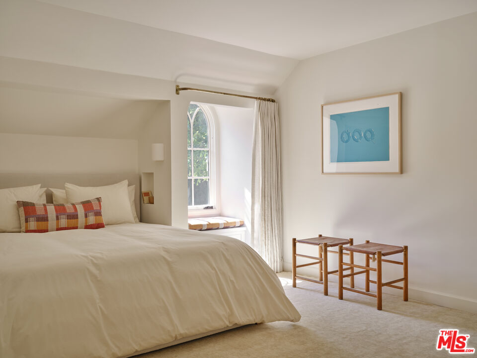 17333 Rancho Street Encino, CA 91316 - Photo 18 of 30 a bedroom with a bed and a table