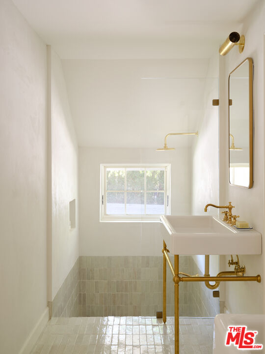 17333 Rancho Street Encino, CA 91316 - Photo 19 of 30 a bathroom with a sink and a mirror