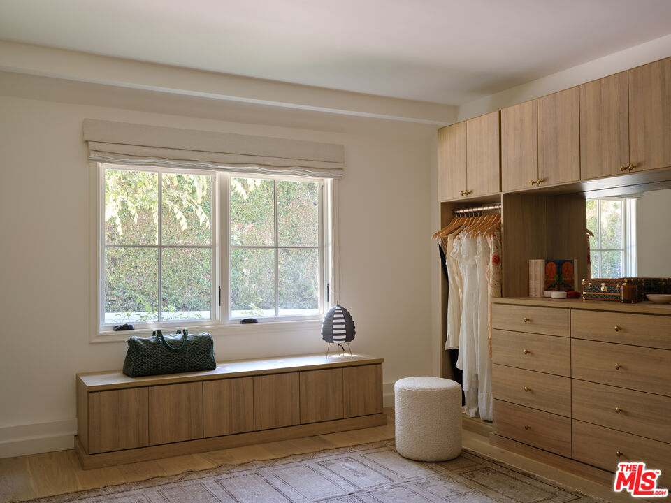 17333 Rancho Street Encino, CA 91316 - Photo 20 of 30 a living room with furniture a flat screen tv and a window