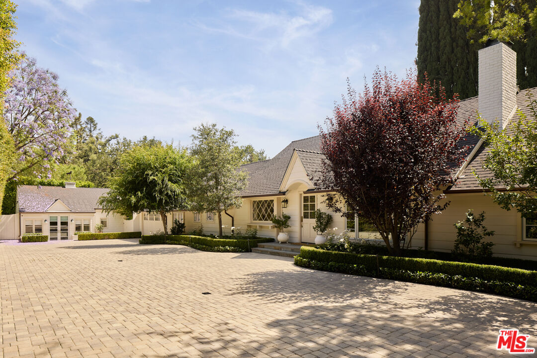 17333 Rancho Street Encino, CA 91316 - Photo 2 of 30 a street view with residential house