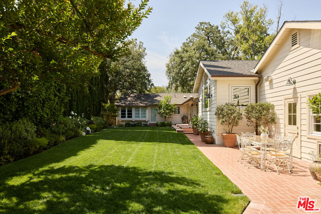 17333 Rancho Street Encino, CA 91316 - Photo 22 of 30 a view of a house with backyard and sitting area
