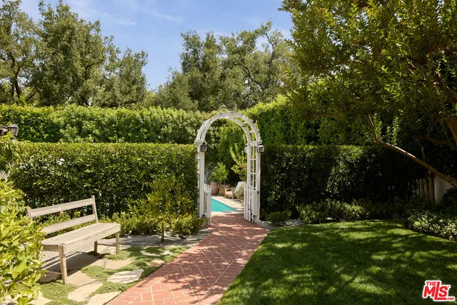 a spacious bedroom with a bed a couch and dresser