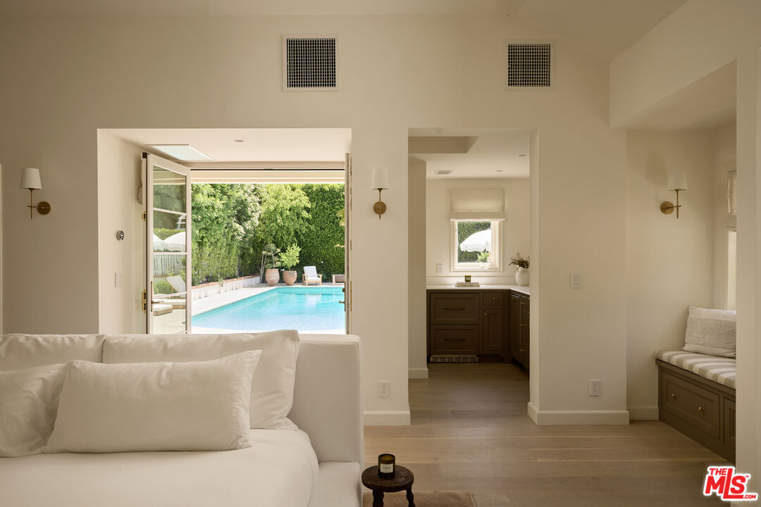 17333 Rancho Street Encino, CA 91316 - Photo 28 of 30 a living room with furniture and a yard