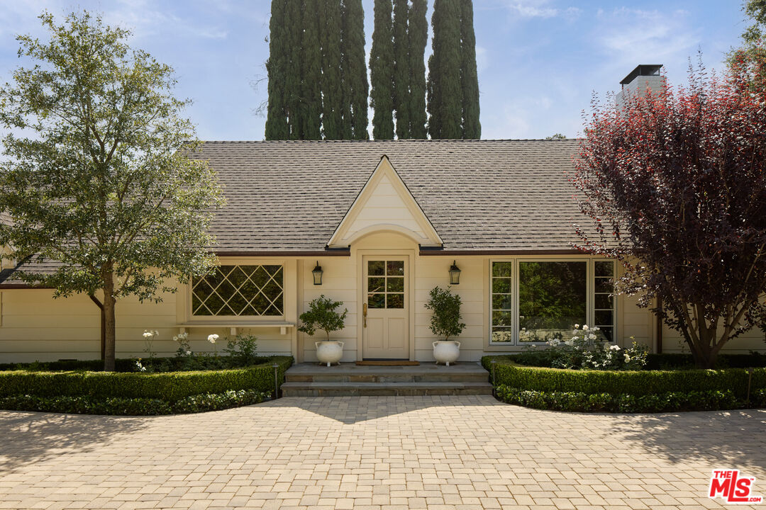 17333 Rancho Street Encino, CA 91316 - Photo 4 of 30 a view of a house with a yard