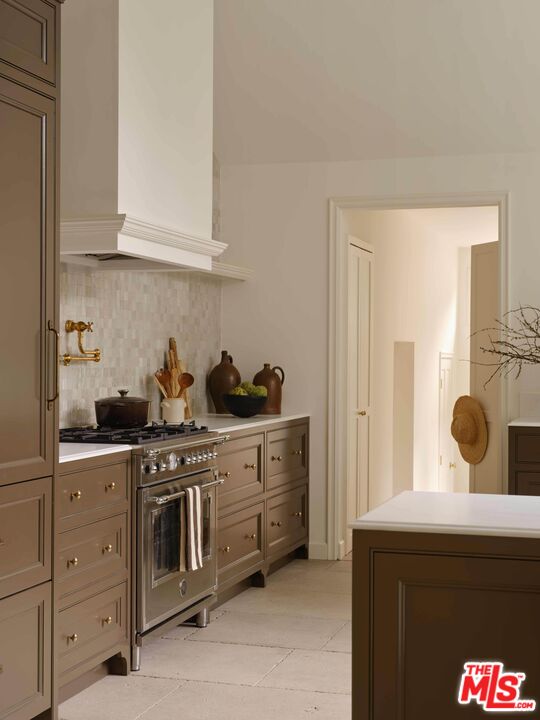 17333 Rancho Street Encino, CA 91316 - Photo 9 of 30 a kitchen with white cabinets and sink