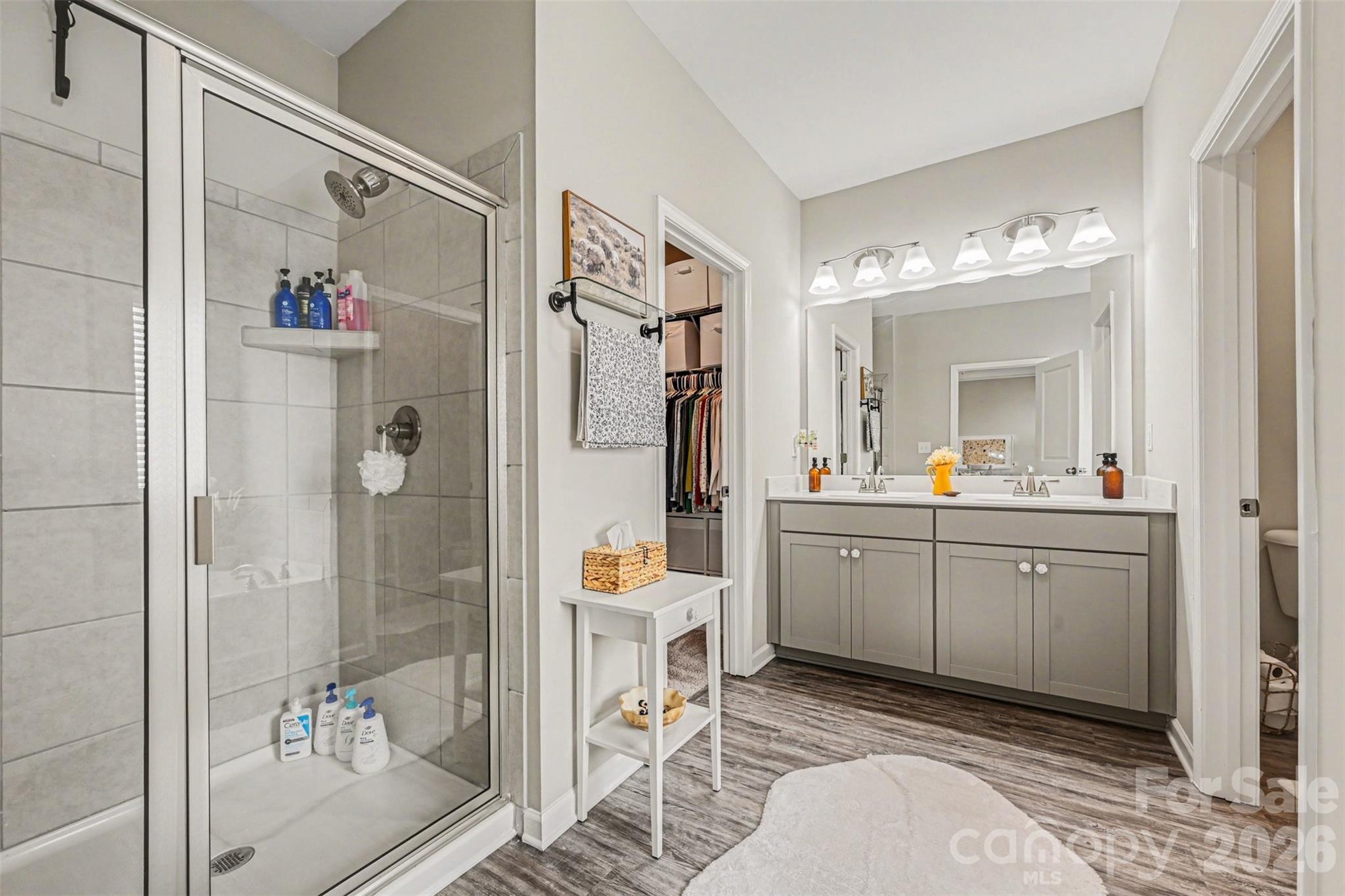 425 Kiser Lane Locust, NC 28097 - Photo 18 of 25 a bathroom with a double vanity sink mirror and shower